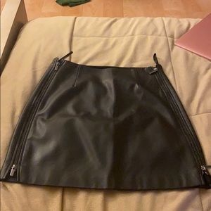 Black zippered mini skirt.